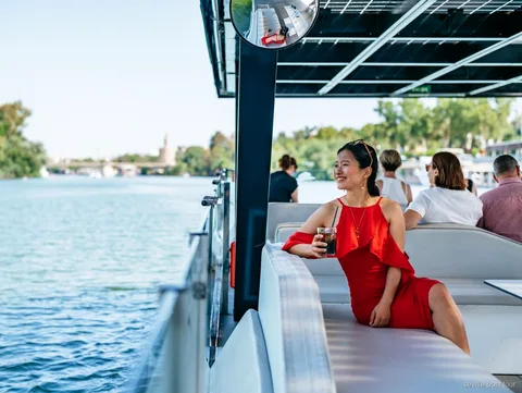 Seville Guadalquivir River Eco Cruise boat sailing past the Torre del Oro